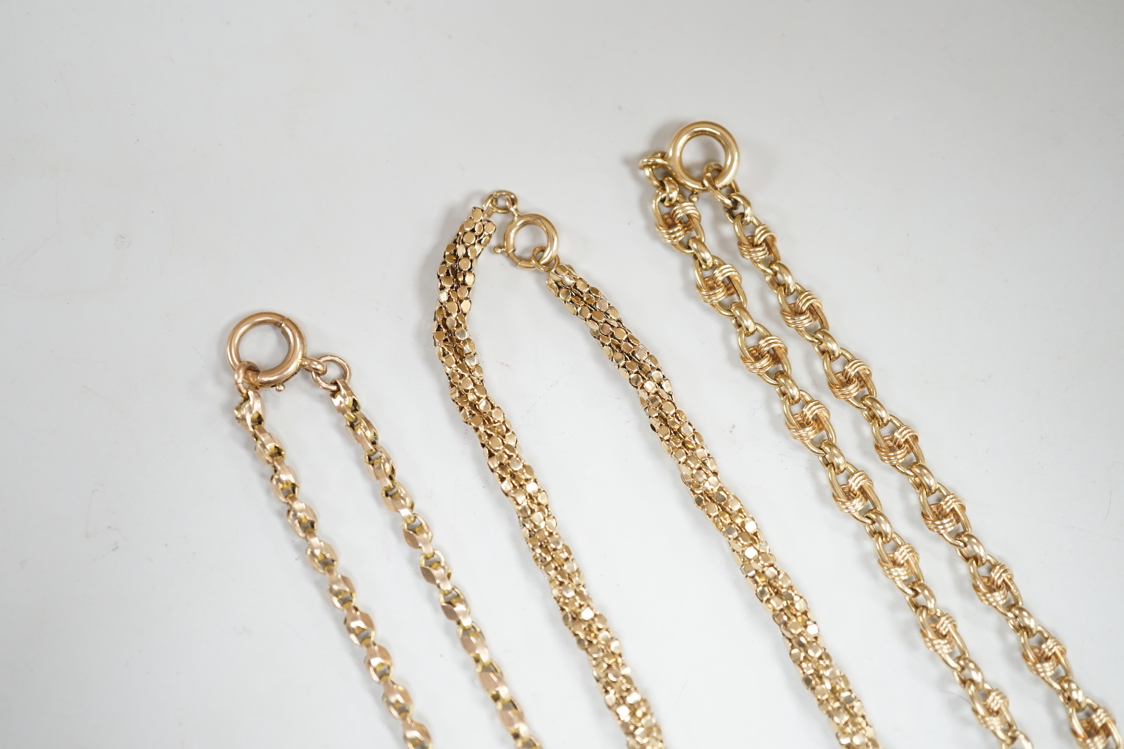 Two 9ct gold chains including triple strand twist, together with a 9c chain, gross weight 34.6 grams.